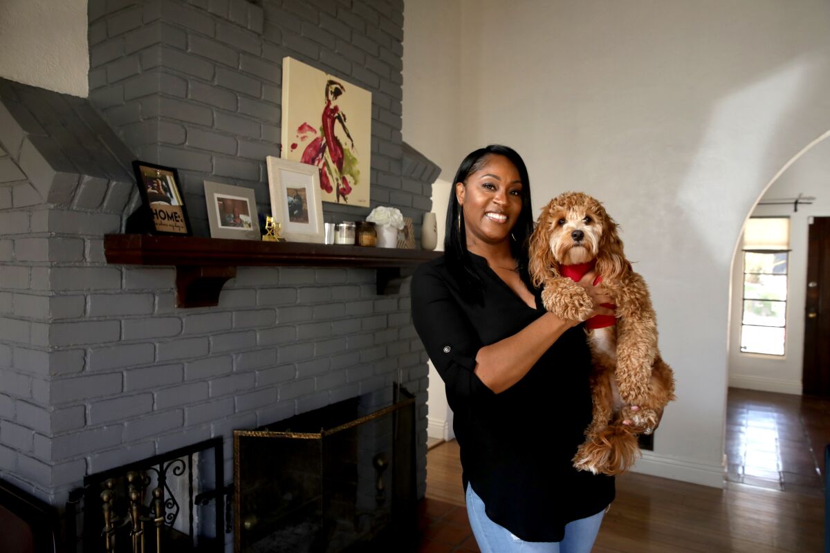 Stephanie Mothershed with her dog Method Man at home 