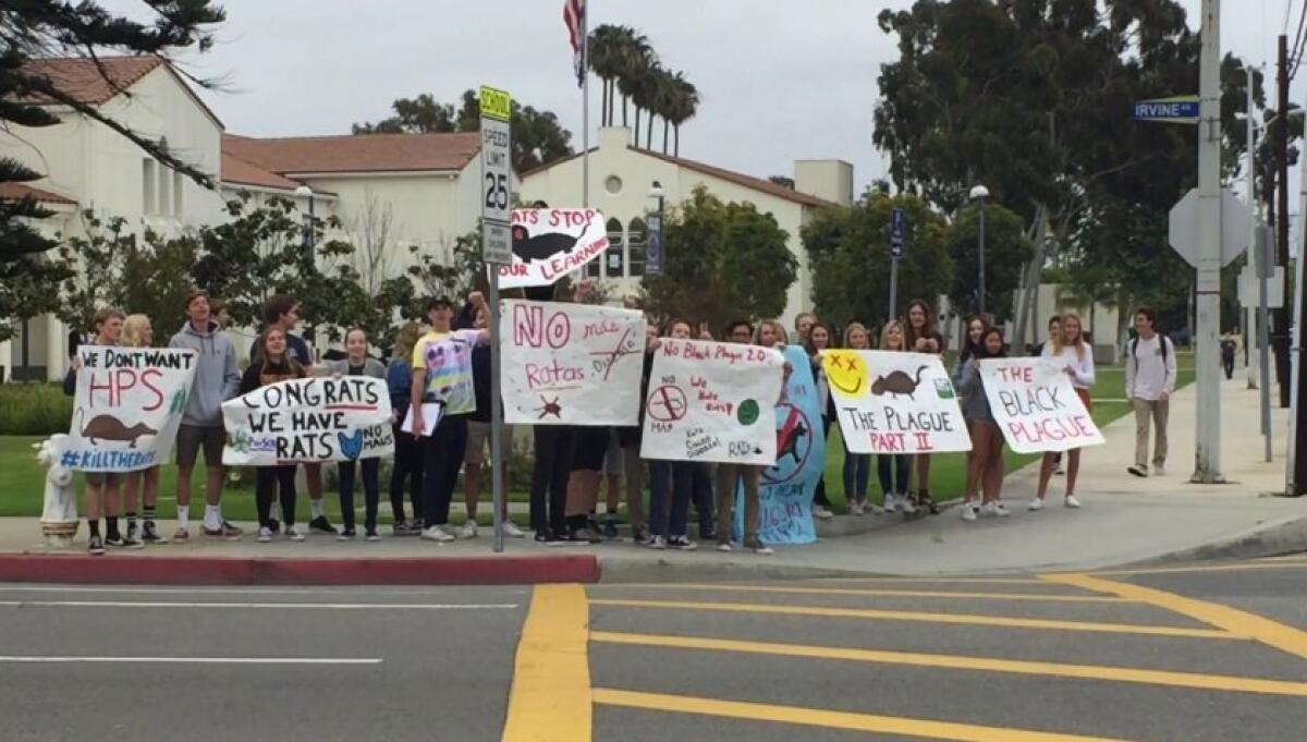 Newport Harbor High School students and teachers demonstrate in 2018 to protest what they described as a rat infestation at the school’s Dodge Hall, where math and world language classes are held.