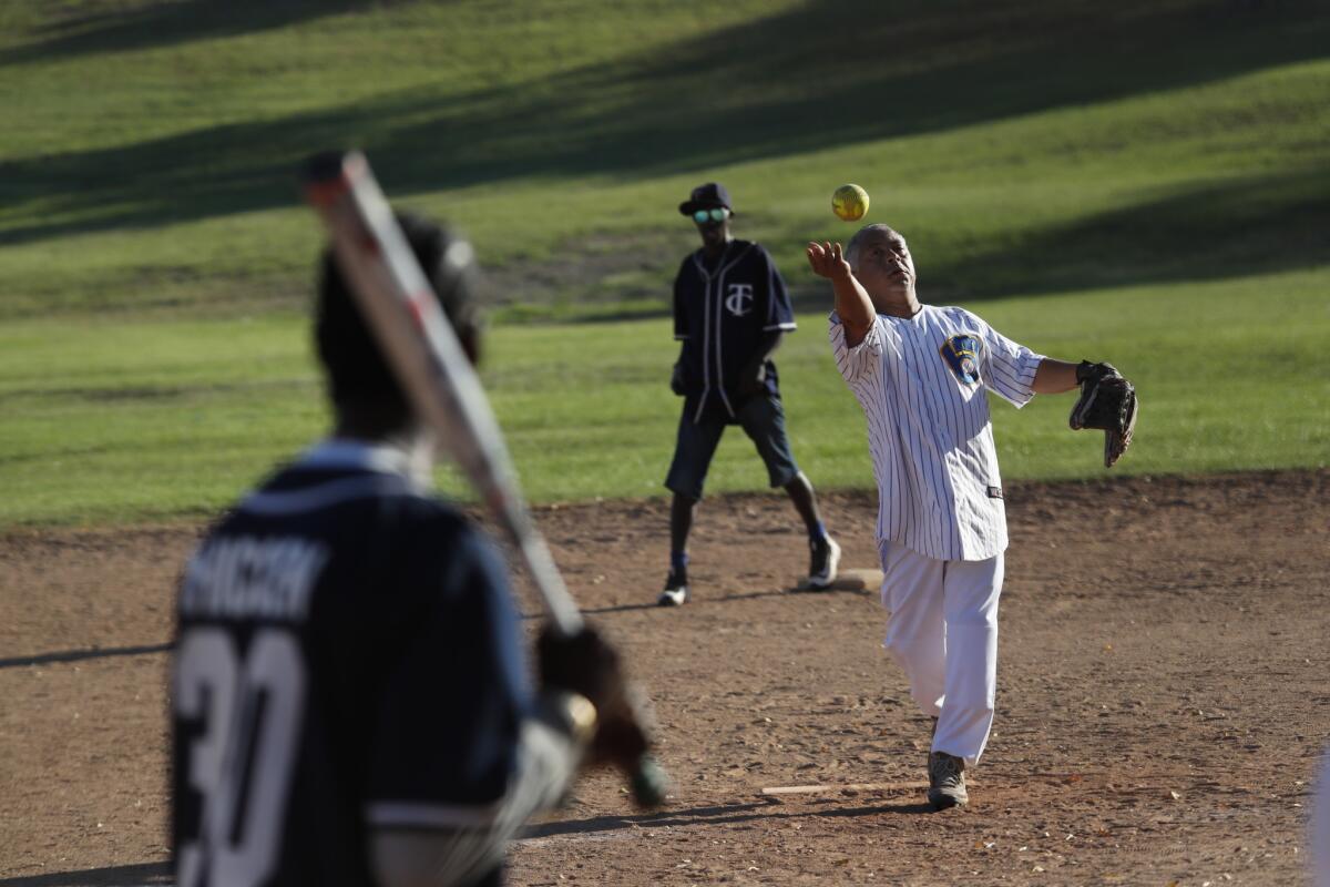 "Mizike" pitches during the game.