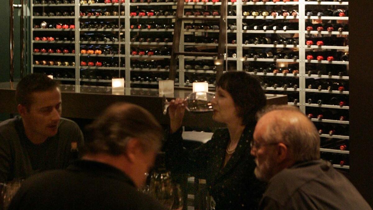 Vertical Wine Bistro in Pasadena. The dining area and the wine shelf at the restaurant.