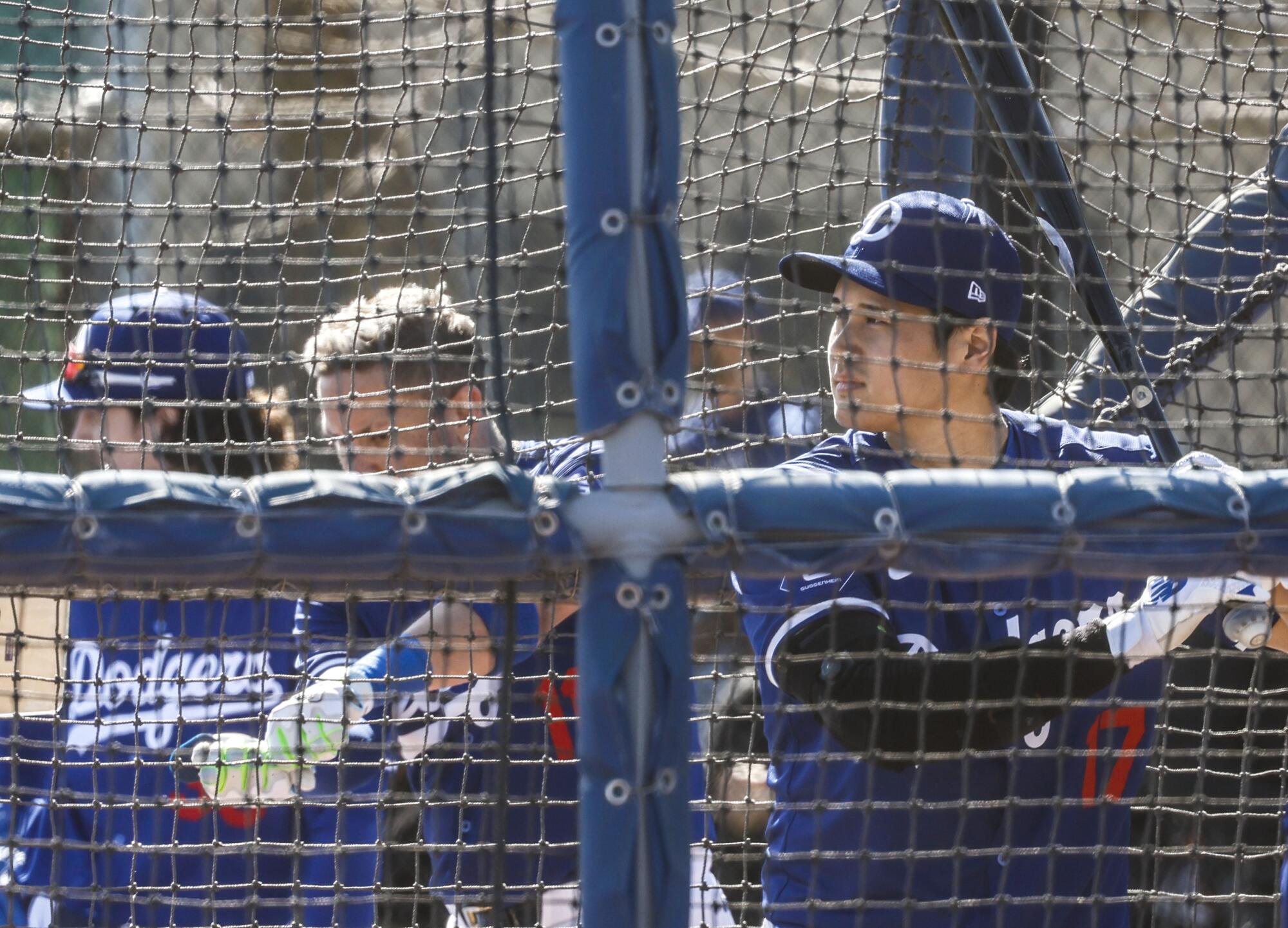 Shohei Ohtani, right, in the batting cage at Dodgers spring training.