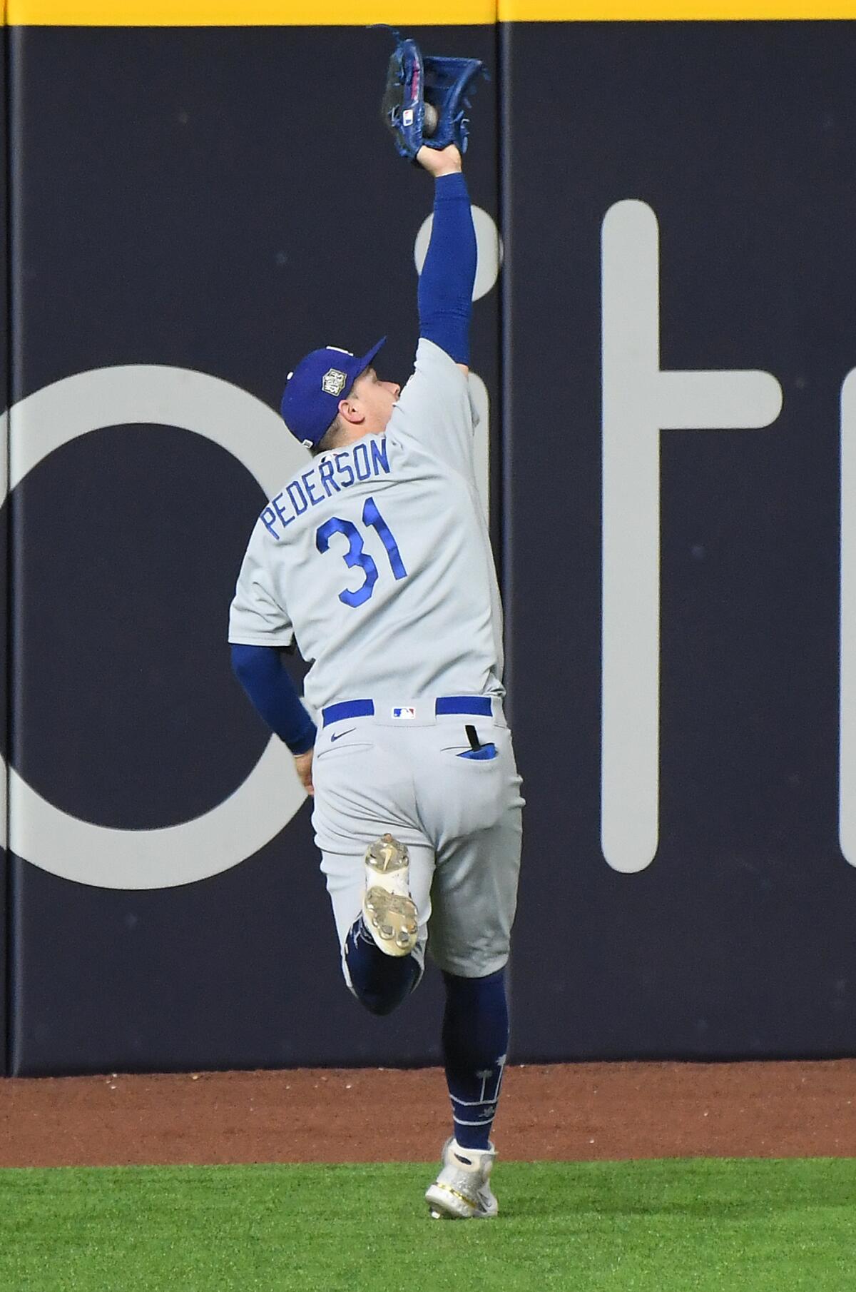 Dodgers left fielder Joc Pederson makes a catch off the bat of Rays' Joey Wendle during the seventh inning.