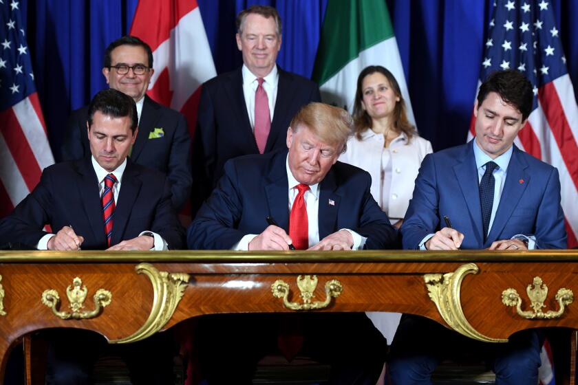 Mexico's President Enrique Pena Nieto (L) US President Donald Trump (C) and Canadian Prime Minister Justin Trudeau, sign a new free trade agreement in Buenos Aires, on November 30, 2018, on the sidelines of the G20 Leaders' Summit. - The revamped accord, called the US-Mexico-Canada Agreement (USMCA), looks a lot like the one it replaces. But enough has been tweaked for Trump to declare victory on behalf of the US workers he claims were cheated by NAFTA. (Photo by SAUL LOEB / AFP)SAUL LOEB/AFP/Getty Images ** OUTS - ELSENT, FPG, CM - OUTS * NM, PH, VA if sourced by CT, LA or MoD ** ** OUTS - ELSENT, FPG, CM - OUTS * NM, PH, VA if sourced by CT, LA or MoD **