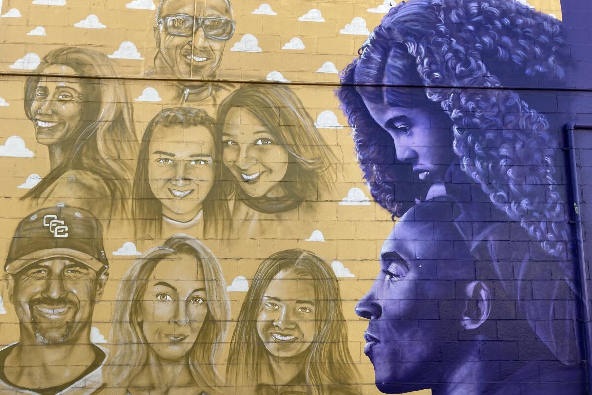 A Costa Mesa mural shows the images of the nine victims of a Jan. 26, 2020, helicopter crash.