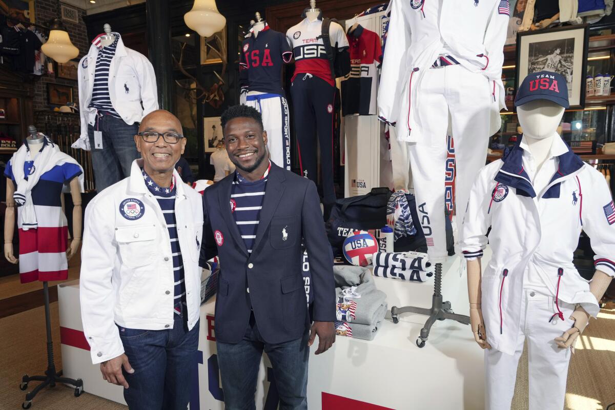 Olympic medalists in fencing, Peter Westbrook, left, and Daryl Homer model the Team USA Tokyo Olympic opening ceremony uniforms at the Ralph Lauren SoHo store on Wednesday, July 7, 2021, in New York. (Photo by Charles Sykes/Invision/AP)