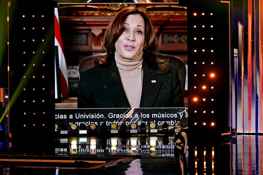 Vice President Kamala Harris speaks on screen at Premio Lo Nuestro at American Airlines Arena