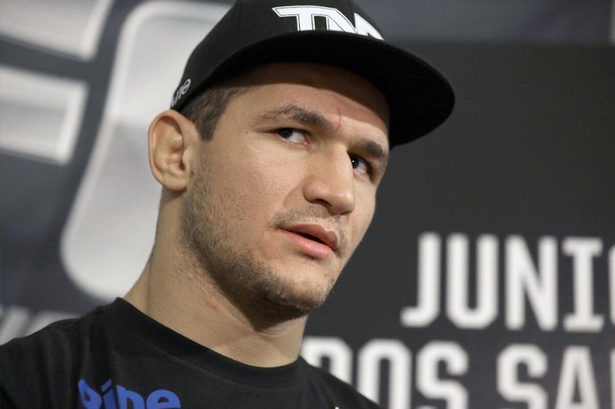 UFC heavyweight champion Junior Dos Santos answers questions on Thursday in Houston.