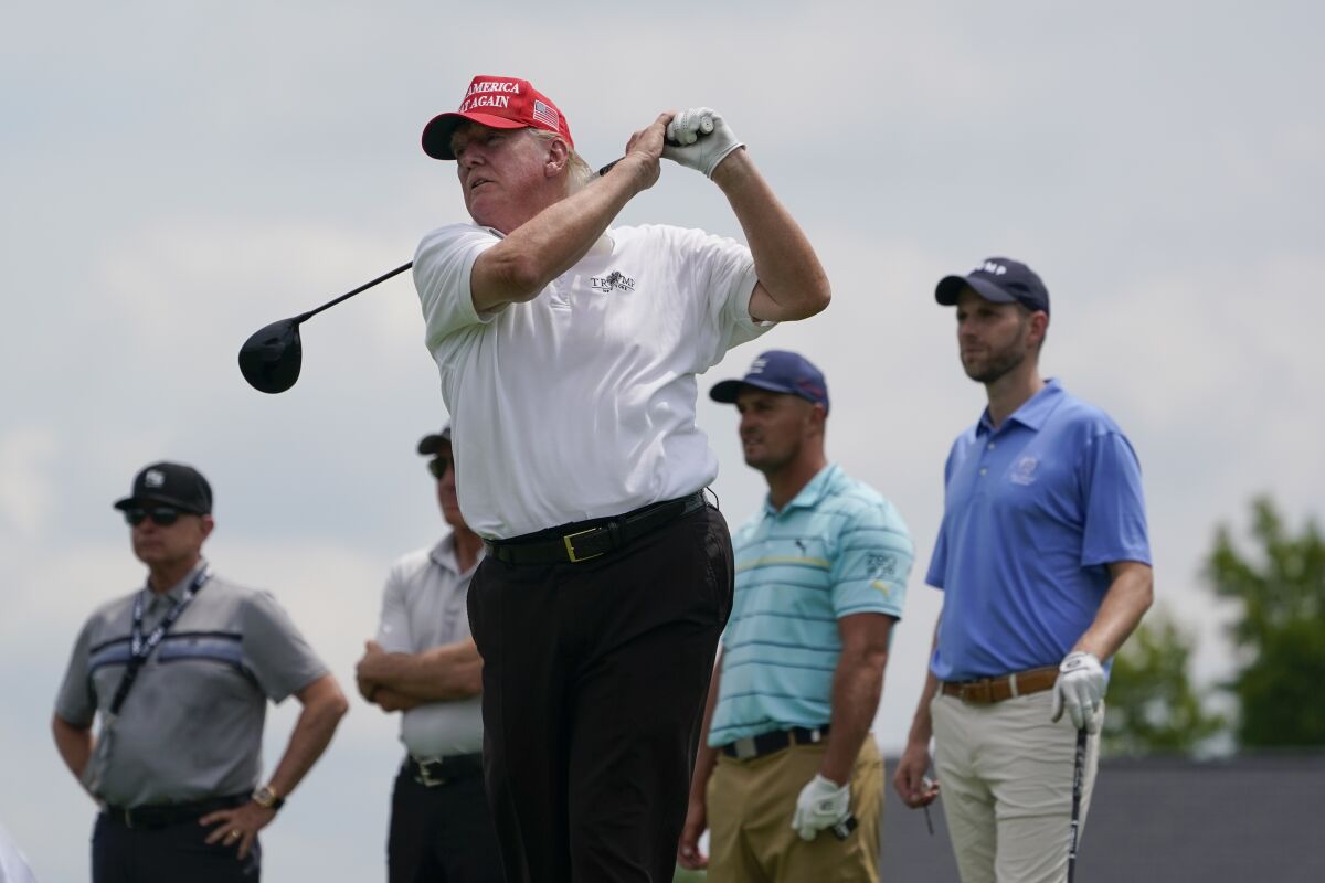 Former President Donald Trump plays during Thursday's pro-am round in advance of an LIV Golf tournament