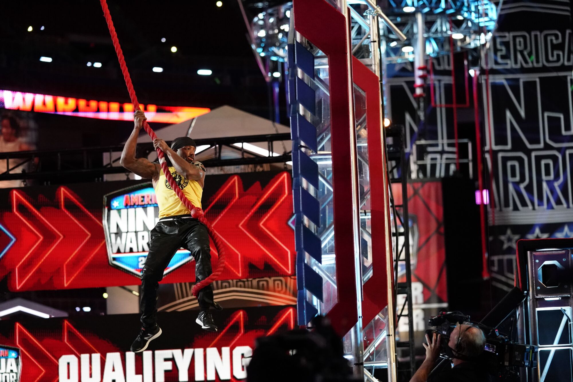 Najee Richardson competes in the new "American Ninja Warrior" as a masked camera operator films his run.