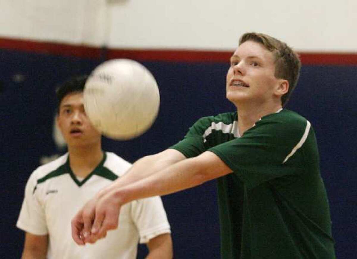 Providence's Kieran McGroarty looks to where he is going to bump the serve into play against Bell-Jeff in a boys volleyball match at Bellarmine-Jefferson High School in Burbank on Monday, April 22, 2013.