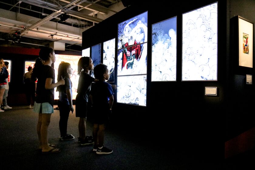Children look at an exhibit at the Comic-Con Museum in San Diego.