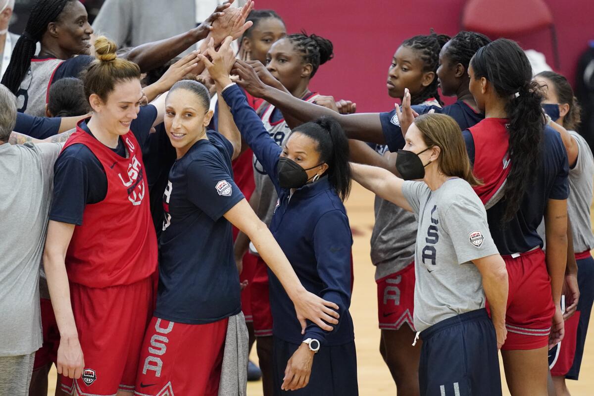 Head coach Dawn Staley, center, coaches during practice.