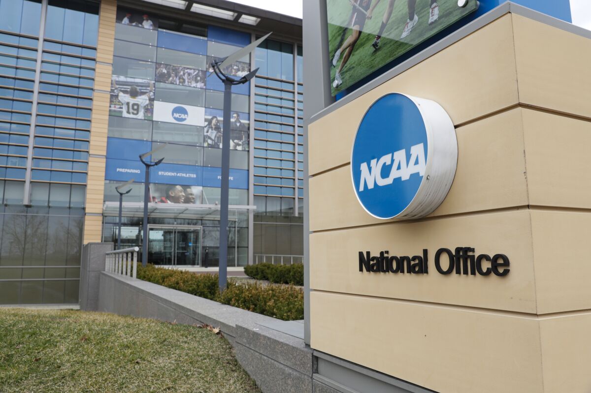 FILE - The NCAA headquarters in Indianapolis is shown in this Thursday, March 12, 2020. The NCAA on Monday, Nov. 8, 2021, set the stage for a dramatic restructuring of college sports that will give each of its three divisions the power to govern itself. (AP Photo/Michael Conroy, File)