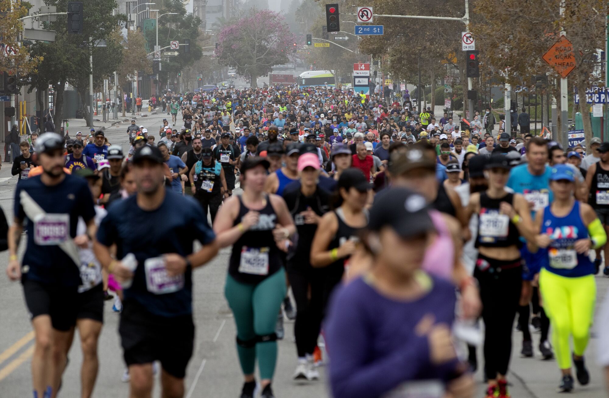 Thousands of runners fill the downtown streets during the L.A. Marathon