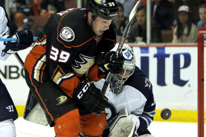 Ducks left wing Matt Beleskey (39) can't get his stick on a loose puck in front of Jets goalie Ondrej Pavelec in the first period of Game 2 on Saturday night in Anaheim.