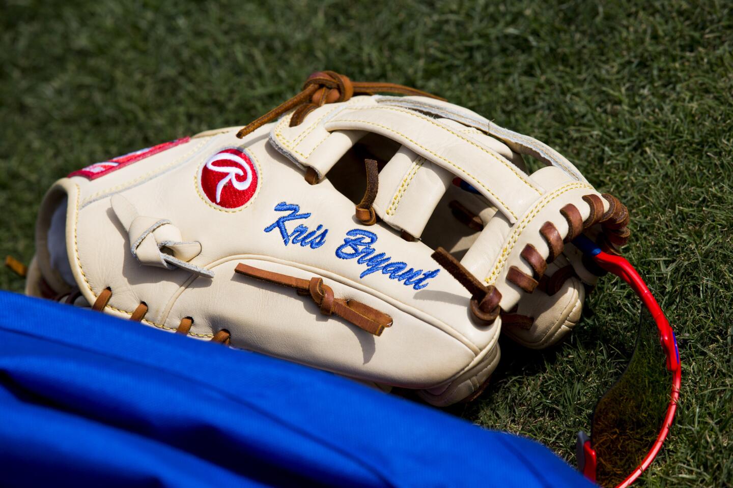 Kris Bryant's glove sits on the ground during spring training at Sloan Park on Monday, Feb. 29, 2016, in Mesa, Ariz.