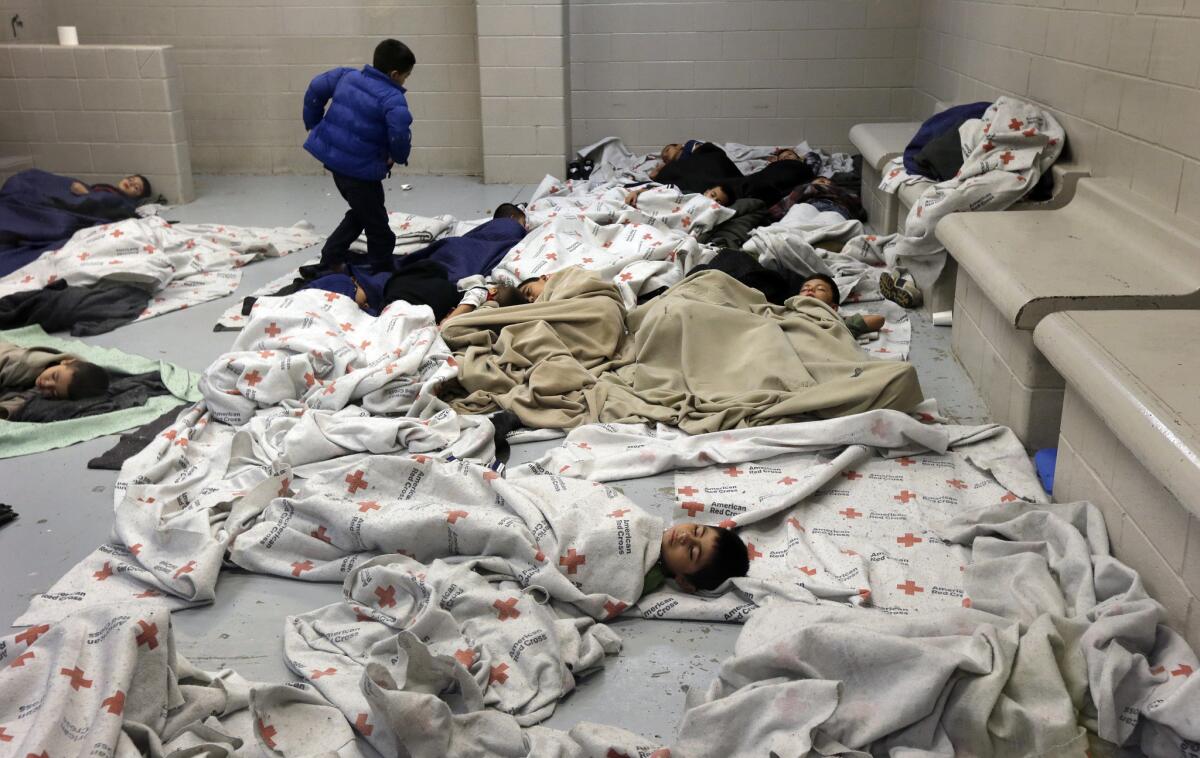 Detainees sleep in a holding cell at a U.S. Customs and Border Protection facility in Brownsville, Texas.