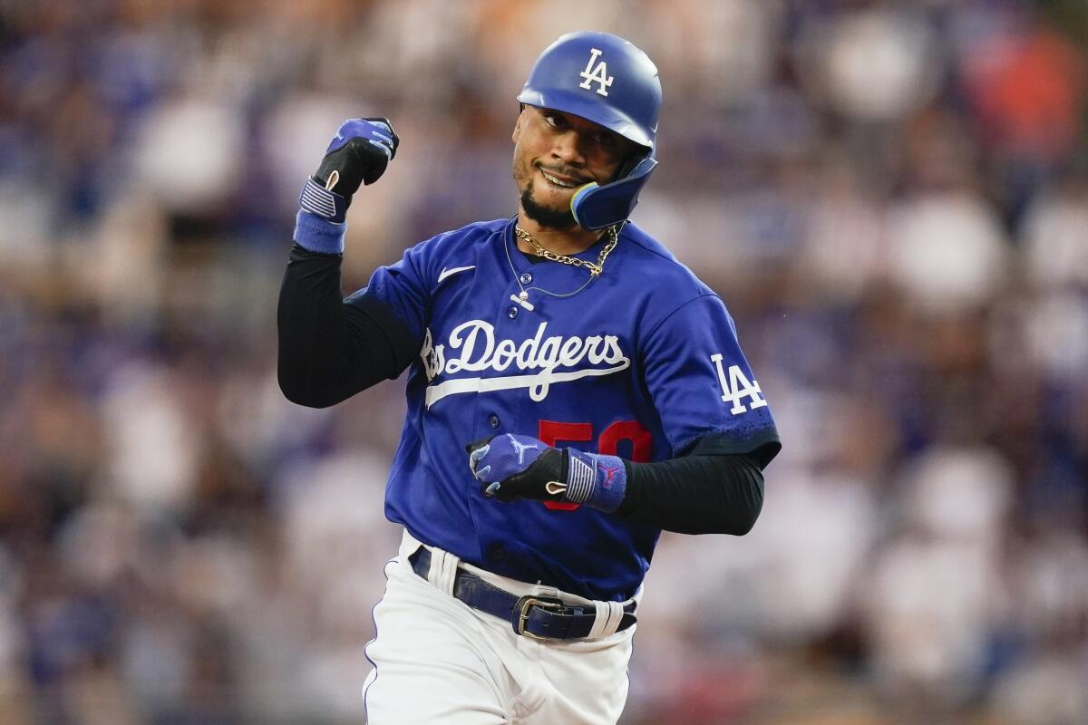 Los Angeles Dodgers' Mookie Betts runs the bases after hitting a home run against the Miami Marlins.