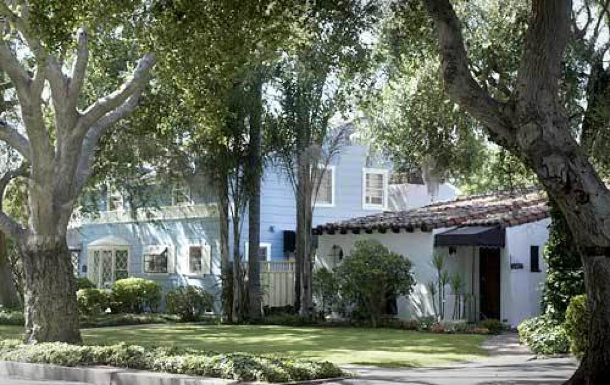 Homes of different eras make comfortable neighbors in the tree-lined Orange County neighborhood.
