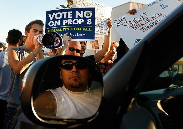 Protesters block and surround a vehicle that has a "Yes on 8" sign taped to the back window during an anti-Proposition 8 demonstration in Westwood that drew hundreds of demonstrators.
