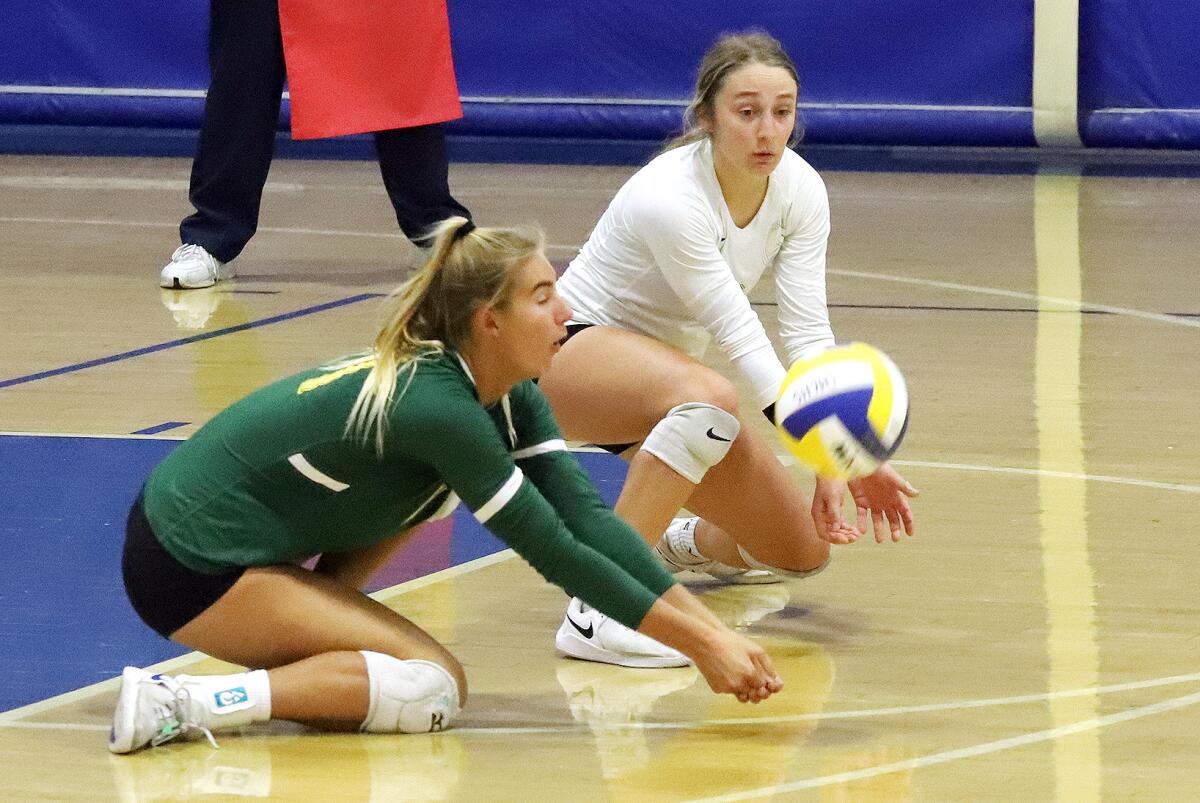 Edison's Summer Witherby (11) and Makenna Jackson (6) dive to keep the ball in play against Santa Margarita on Thursday.