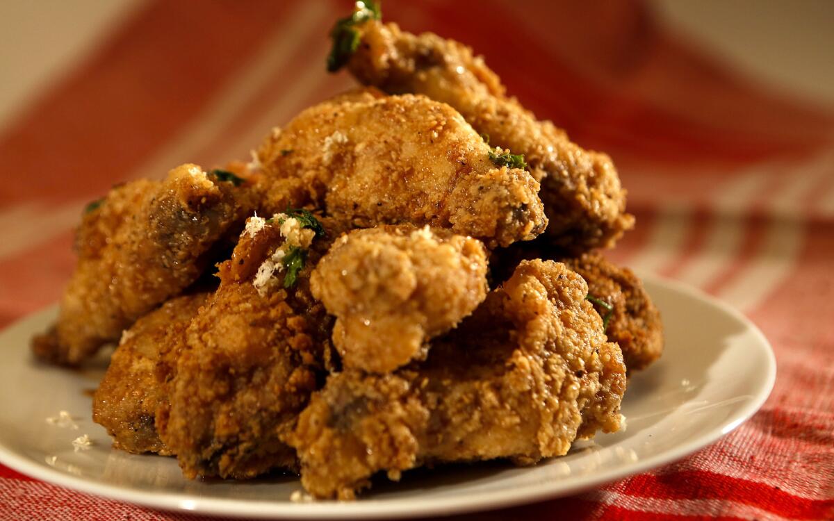 Crispy apple wings with fresh horseradish and curly parsley