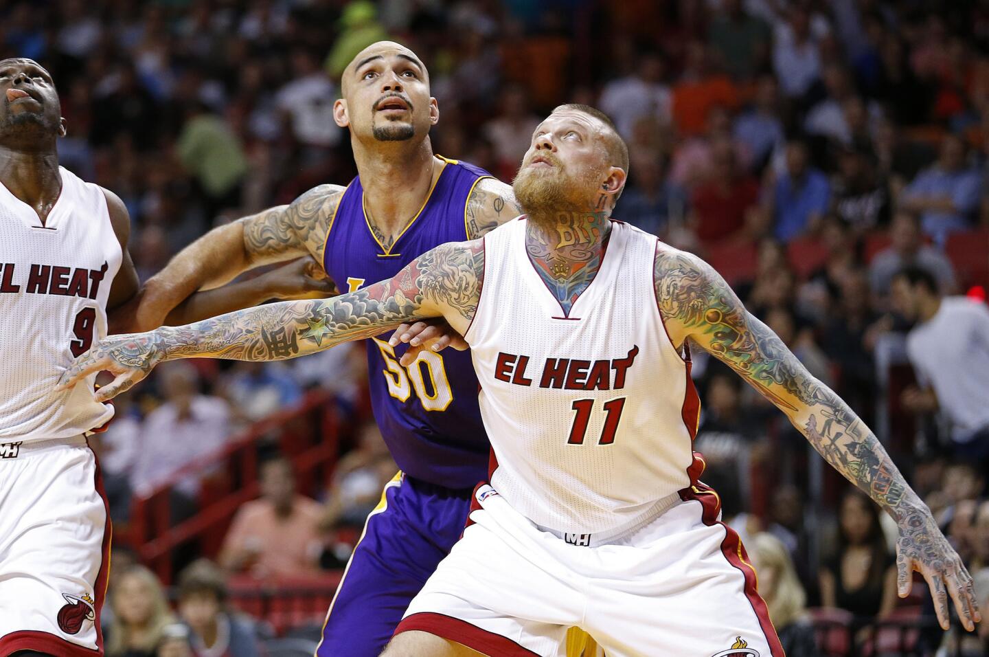 Heat center Chris Anderson boxes out Robert Sacre during the first half of a game Wednesday in Miami at AmericanAirlines Arena.