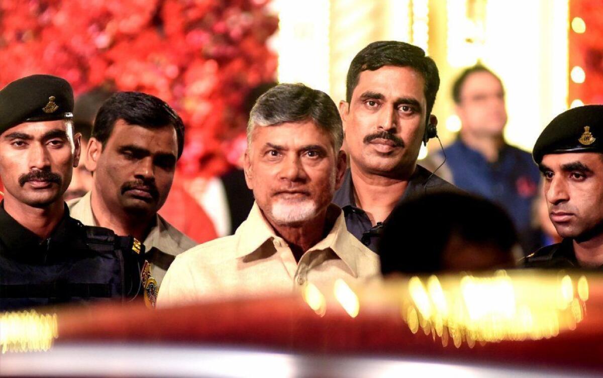 Chandrababu Naidu, center, is shown at the wedding of Indian billionaire Mukesh Ambani's daughter Isha in Mumbai earlier this month.