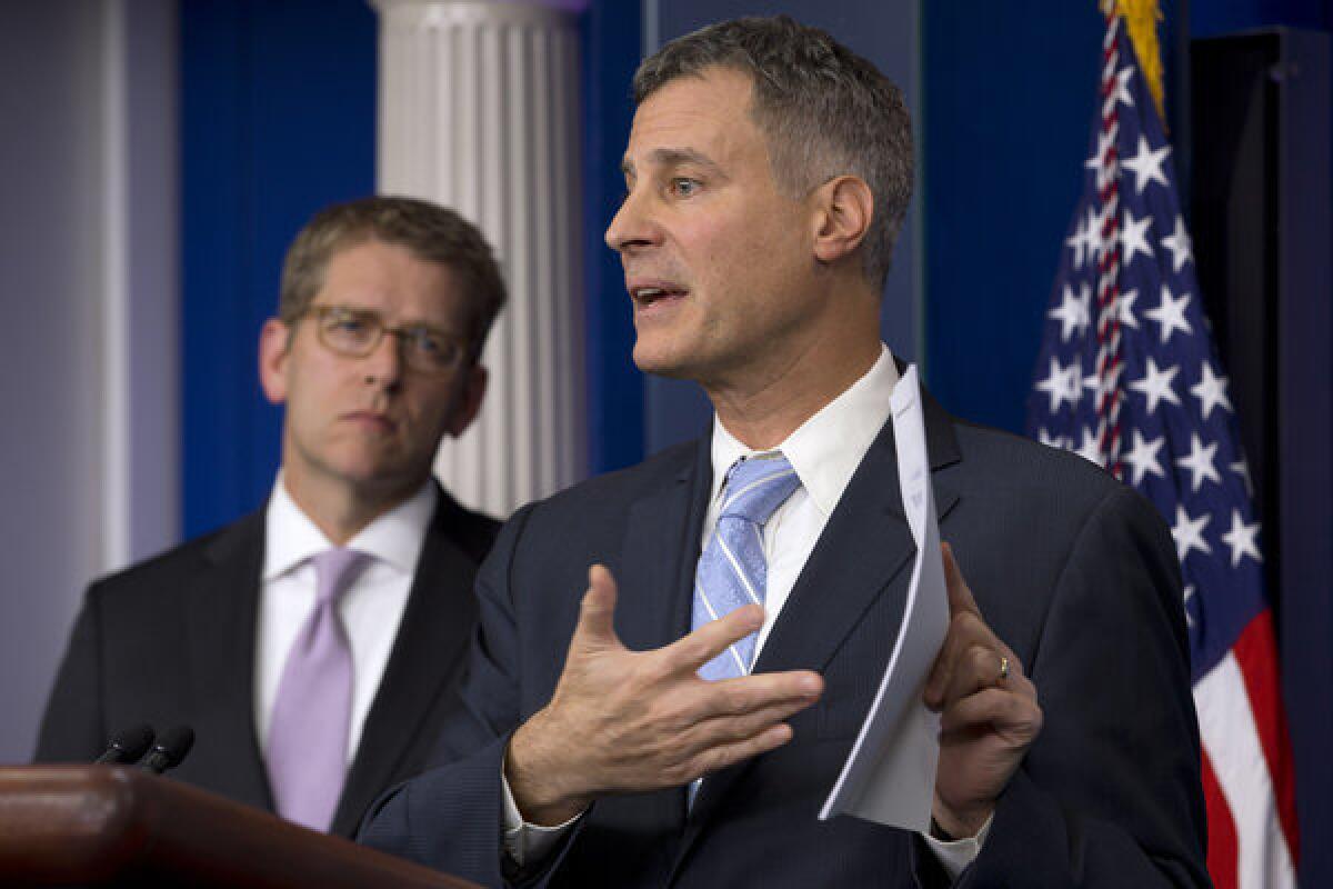 White House Council of Economic Advisors Chairman Alan Krueger, right, accompanied by White House Press Secretary Jay Carney, speaks to reporters about taxes, spending and the fiscal cliff.