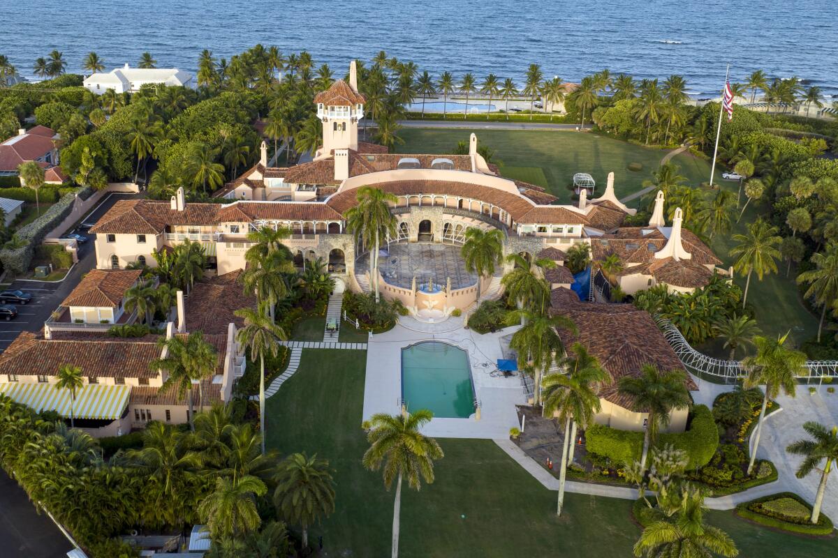 An aerial view of an expansive estate next to the ocean