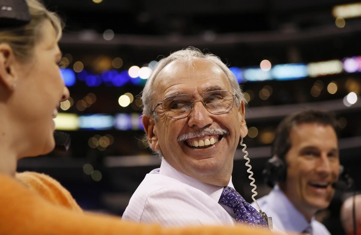 Clippers play-by-play announcer Ralph Lawler shares a laugh with stage manager Brittany Savelkoul, left, and broadcast partner Mike Smith.