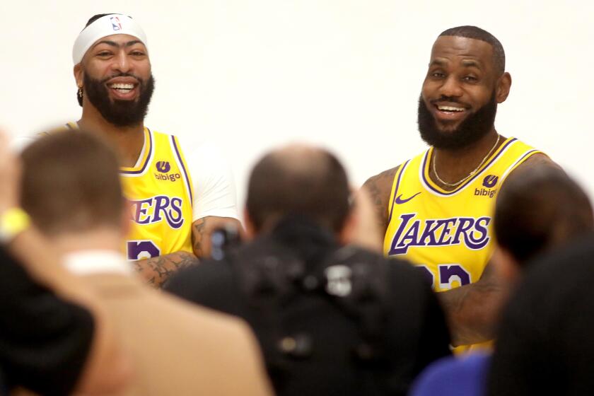 LOS ANGELES, CA - OCTOBER 2, 2023 - Los Angeles Lakers Anthony Davis, left, and LeBron James are still heads above the crowd during Los Angeles Lakers Media Day at the UCLA Health Training Center in El Segundo on October 2, 2023. (Genaro Molina / Los Angeles Times)