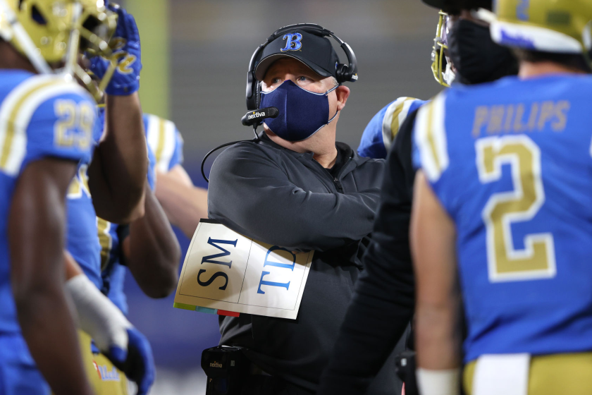 PASADENA, CALIFORNIA - DECEMBER 12: Head coach Chip Kelly of the UCLA Bruins looks on.