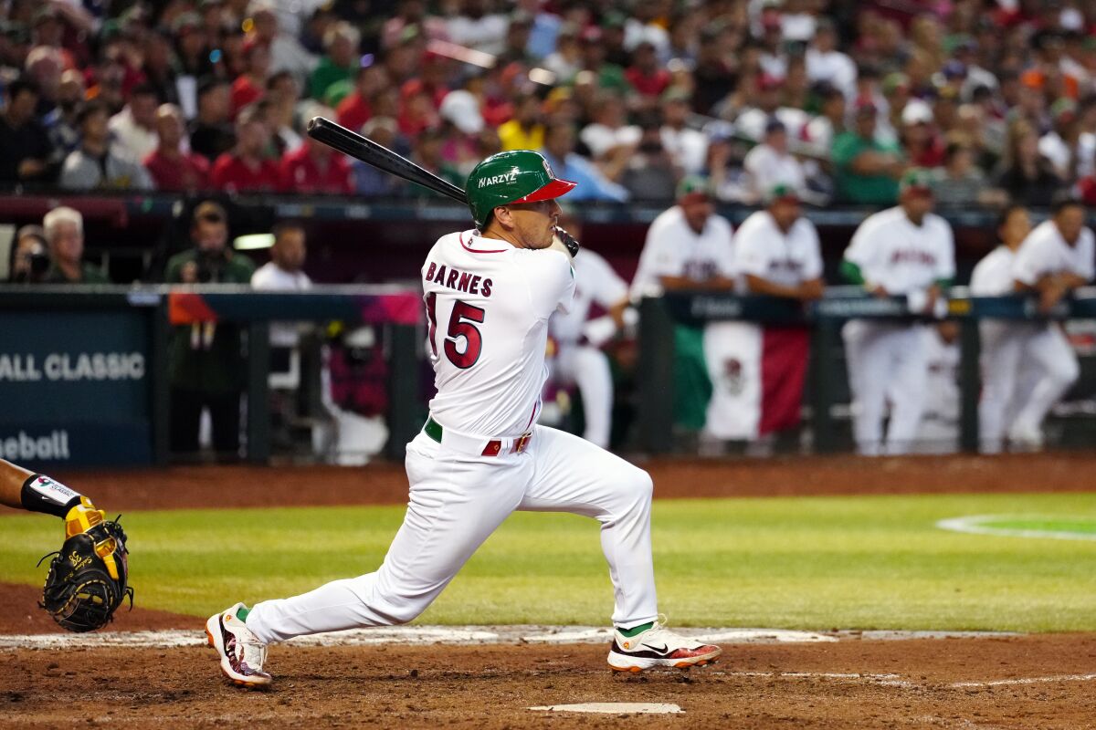 Austin Barnes of Mexico doubles in the ninth inning against Columbia.
