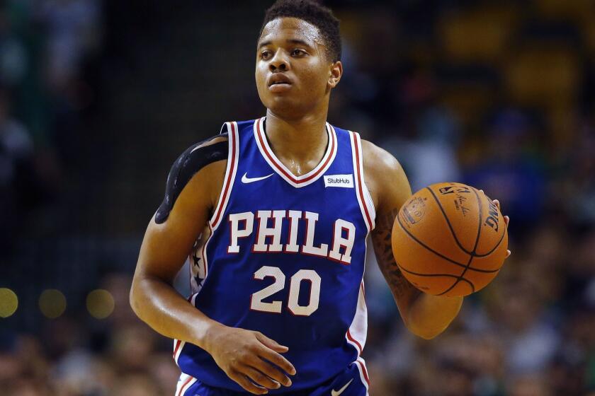FILE - In this Oct. 9, 2017, photo, Philadelphia 76ers guard Markelle Fultz controls the ball during the first quarter of a preseason NBA basketball game against the Boston Celtics in Boston. Fultz is out indefinitely with thoracic outlet syndrome. He visited with several specialists to figure out whats ailing him. The Sixers said the specialists have identified a compression or irritation in the area between the lower neck and upper chest. Physical therapy was recommended for Fultz before returning to play. (AP Photo/Winslow Townson, File)