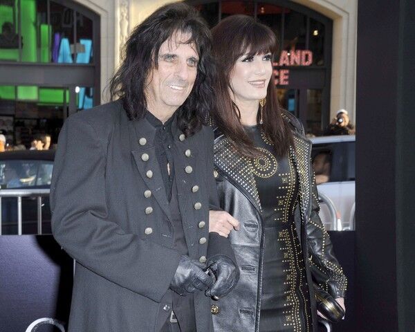 Singer Alice Cooper, left, who plays himself in the film, arrives with his wife, Sheryl.