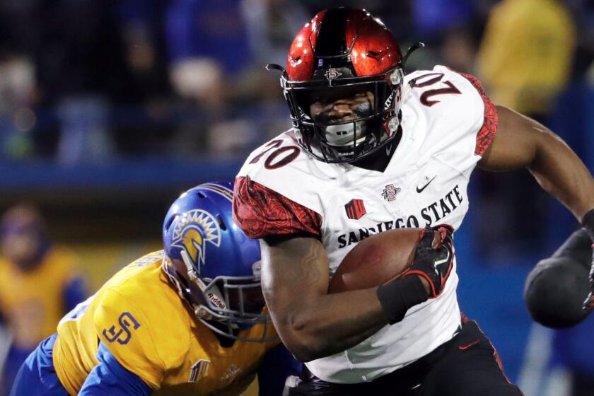 File- This Nov. 4, 2017, file photo shows San Diego State running back Rashaad Penny (20) running against San Jose State during the first half of an NCAA college football game in San Jose, Calif. Penny was selected to the AP All-America team announced Monday, Dec. 11, 2017. (AP Photo/Marcio Jose Sanchez, File)