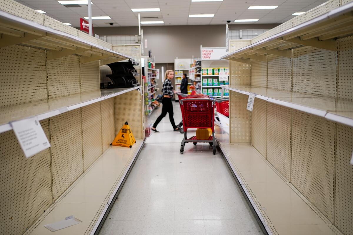 Amid coronavirus hoarding, stores are empty at a Manhattan Beach Target on Friday
