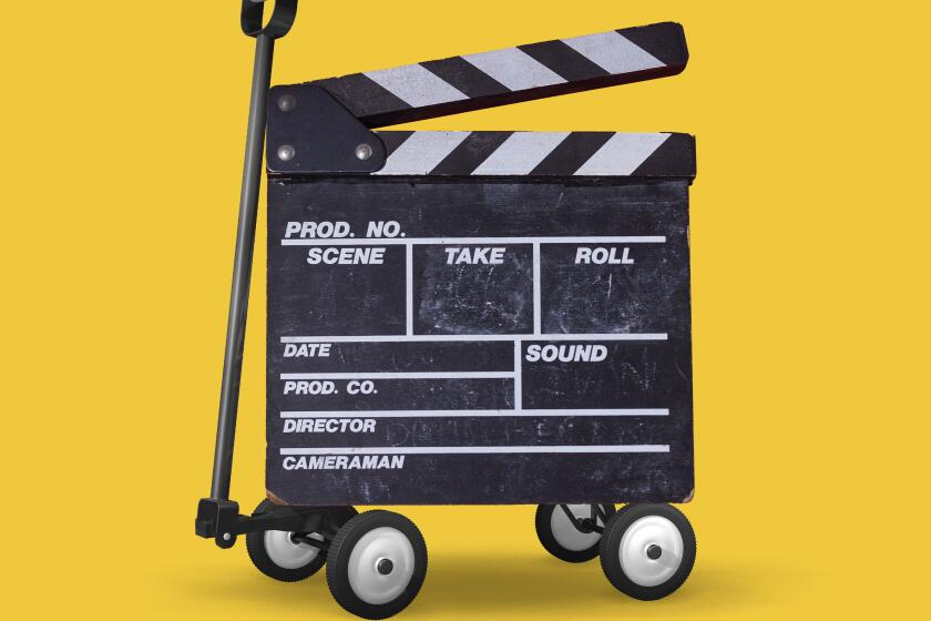 photo illustration of a TV clapper with wagon wheels and a handle