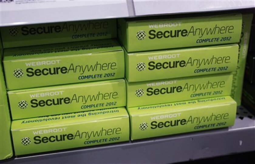 Webroot's SecureAnywhere Complete 2012 software for computer security on display at Best Buy in Mountain View, Calif., Friday, July 6, 2012. Despite repeated alerts, tens of thousands of Americans may lose their Internet service Monday unless they do a quick check of their computers for malware that could have taken over their machines more than a year ago. The warnings about the Internet problem have been splashed across Facebook and Google. Internet service providers have sent notices, and the FBI set up a special website. (AP Photo/Paul Sakuma)