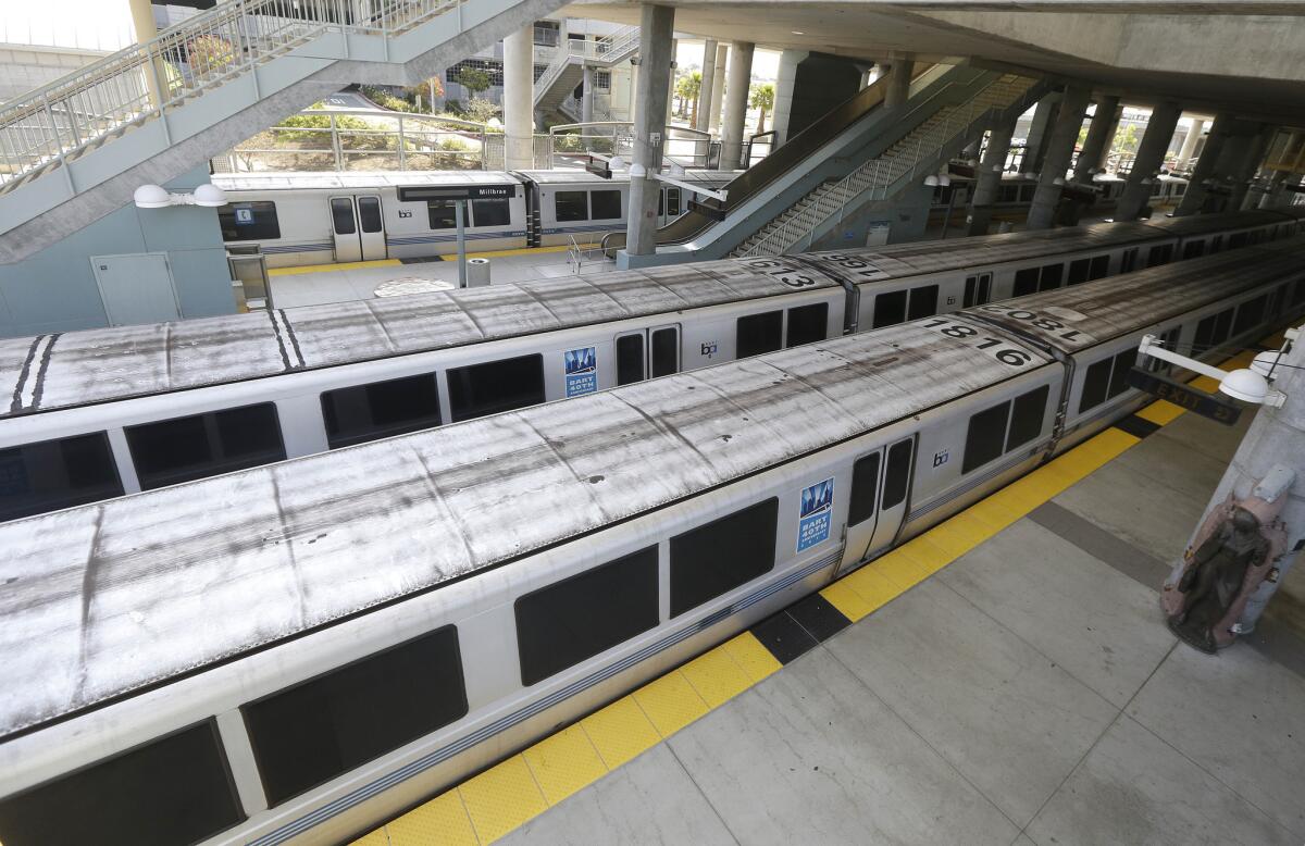 Bay Area Rapid Transit trains are parked at the station in Millbrae.
