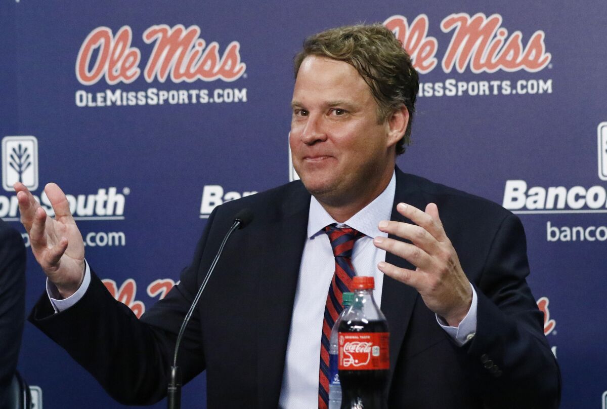 Mississippi coach Lane Kiffin responds to reporters' questions at a news conference
