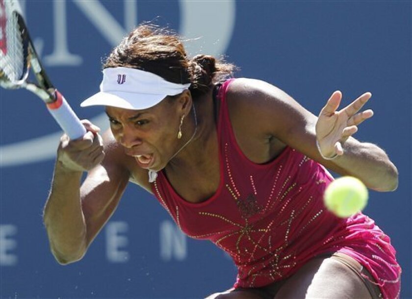 Venus Williams of the United States returns the ball to Shahar Peer of Israel at the U.S. Open tennis tournament in New York, Sunday, Sept. 5, 2010. (AP Photo/Kathy Willens)
