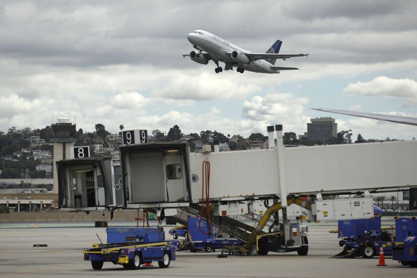 An United Airlines left takes off from San Diego International Airport headed for Houston on March 24, 2020. The airport has seen a dramatic drop in travel since the outbreak of coronavirus.