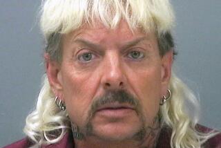 A mug shot of a middle-aged man with a peroxide-blond mullet and multiple small hoop earrings