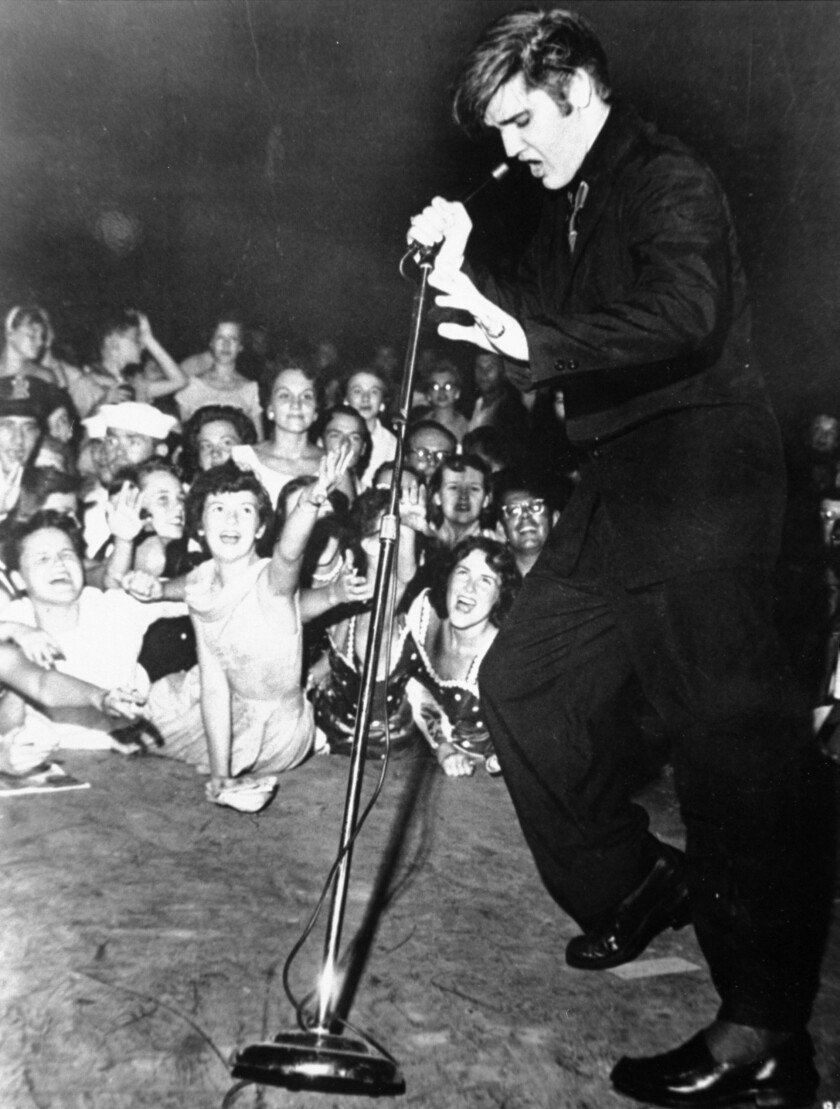 Elvis Presley performs at the Mississippi-Alabama State Fair in 1956. 
