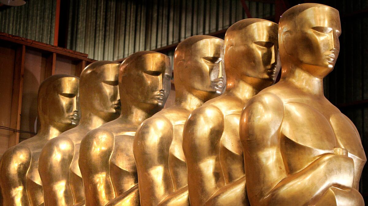 Oversized Oscar statues line the Dolby Theatre in Hollywood for the Academy Awards.