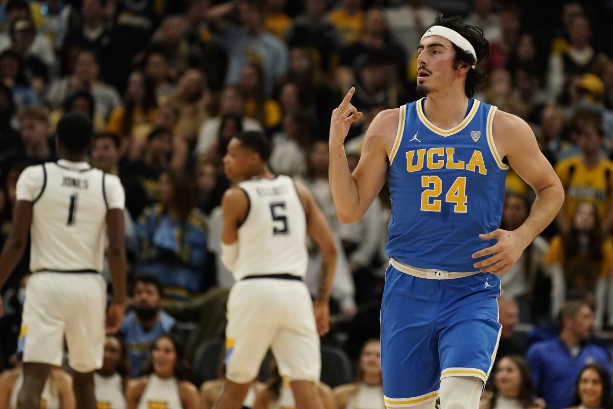 UCLA's Jaime Jaquez Jr.creacts after making a three-pointer against Marquette on Saturday night. The Bruins won 67-56.