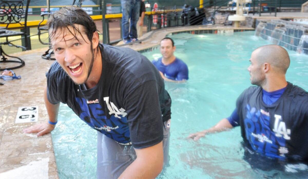 Clayton Kershaw and his Dodgers teammates celebrate clinching the National League West title with a dip in the Arizona Diamondbacks pool, a move criticized by Sen. John McCain (R-Ariz) among others.
