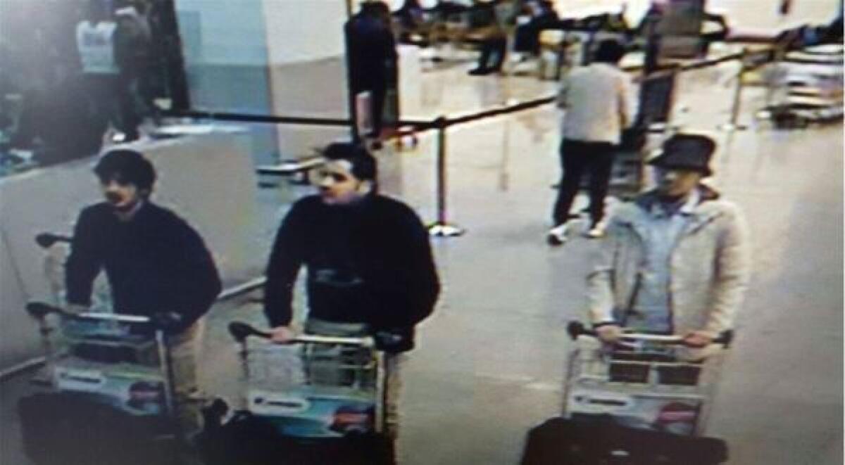 A picture released on March 22, 2016 by the Belgian federal police by the order of the federal prosecutor shows suspects being sought in Tuesday morning's attacks at Brussels Airport.